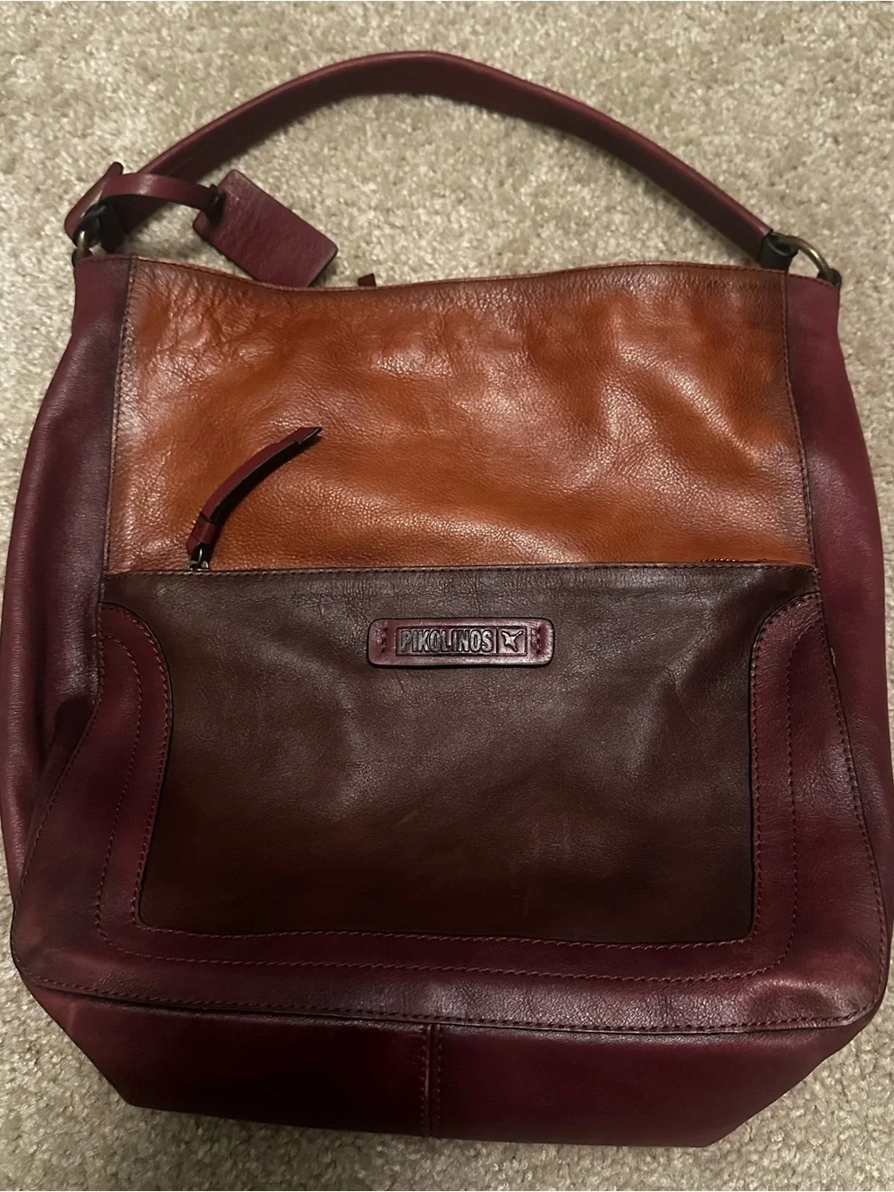 Pikolinos leather hobo handbag in a multi-tonal garnet and cuero brown color Bag